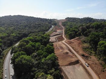High angle view of road amidst plants against sky