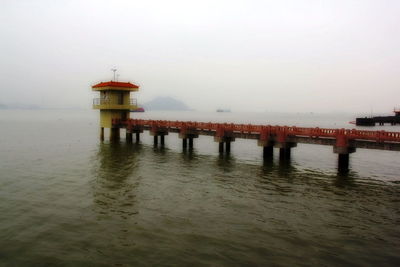 Pier on sea against sky