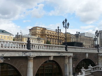 Railing against buildings in city