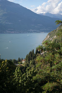 Scenic view of sea and mountains against sky