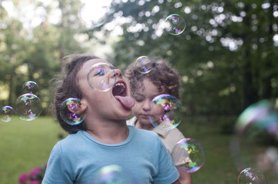 High angle view of girl with bubbles