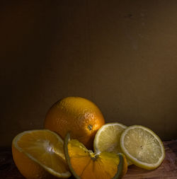 Close-up of orange fruit against black background