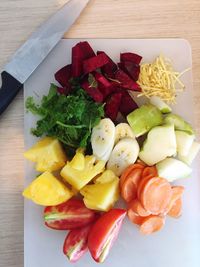 High angle view of chopped fruits on table