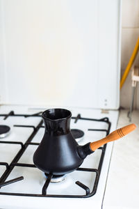 Turk on a gas stove, close-up