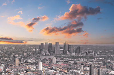 High angle view of modern buildings against sky during sunset