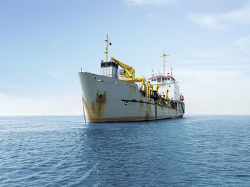 Boat in sea against sky