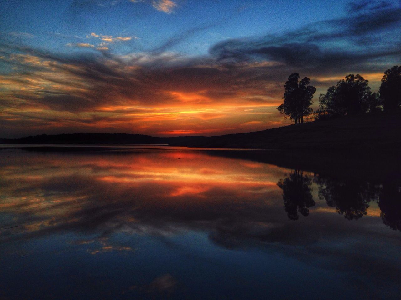 sunset, tranquil scene, tranquility, scenics, sky, water, beauty in nature, reflection, silhouette, tree, lake, cloud - sky, idyllic, nature, orange color, cloud, dramatic sky, calm, dusk, non-urban scene