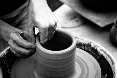 Cropped image of man making pottery