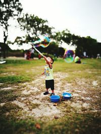 Boy playing in field