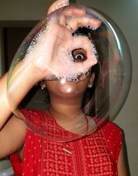 Portrait of a beautiful young woman with bubbles