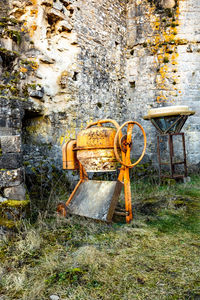 View of abandoned chair against wall