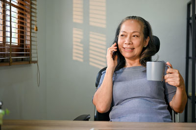 Young woman using mobile phone