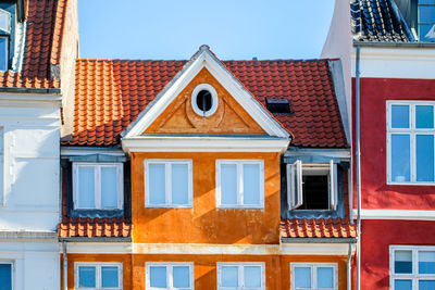 Houses against sky in city