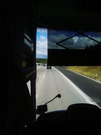 Road seen through car window