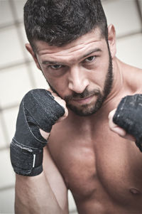 Close-up portrait of shirtless man