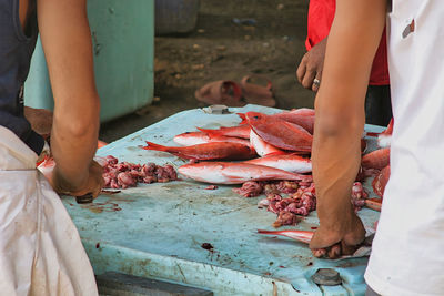 Midsection of man preparing food