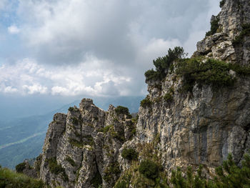 Low angle view of rock formations against sky