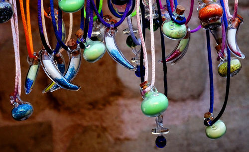 Close-up of multi colored hanging for sale in market