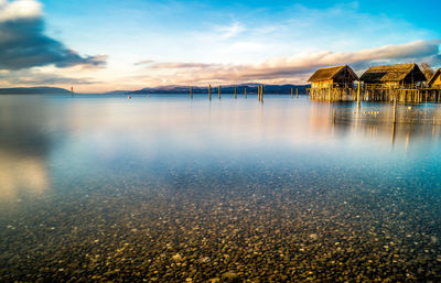 Scenic view of lake against sky during sunset