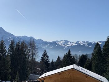 Scenic view of snow covered mountain against sky