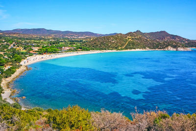 High angle view of sea against clear blue sky