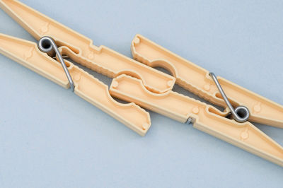 High angle view of clothespins on table against white background