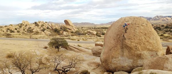 Scenic view of rock formations in desert against sky