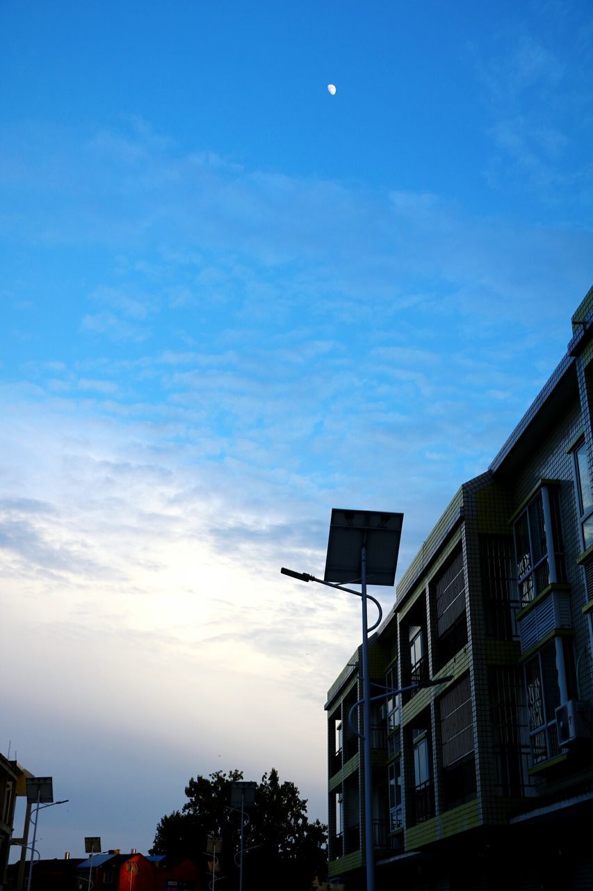 building exterior, architecture, built structure, low angle view, sky, blue, residential building, residential structure, building, cloud, cloud - sky, high section, outdoors, no people, nature, day, beauty in nature, growth