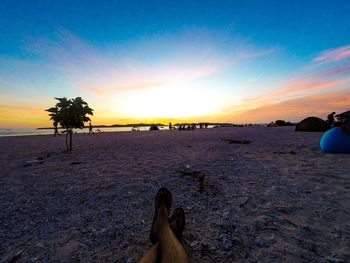 Scenic view of beach against sky during sunset