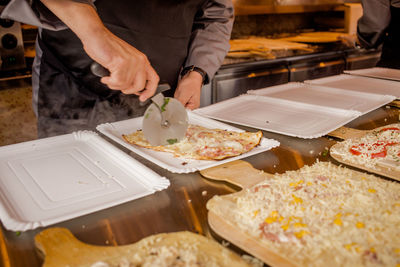 Close-up of man preparing food