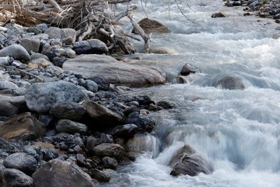 Scenic view of stream flowing through rocks