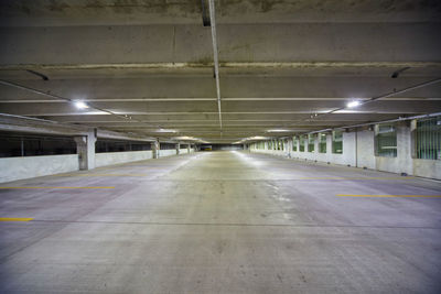 Rear view of man walking in tunnel