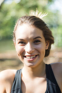 Portrait of teenage girl sitting in park