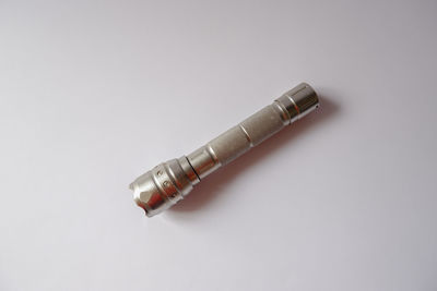 High angle view of cigarette against white background