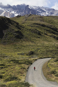 Scenic view of road by mountains