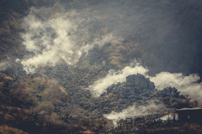 Aerial view of tree mountain against sky