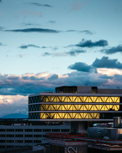 Low angle view of building against sky at sunset