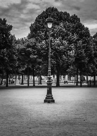 Street light against cloudy sky