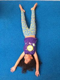 High angle view of girl against blue background