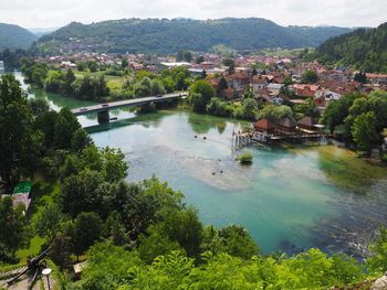 High angle view of river amidst buildings in city