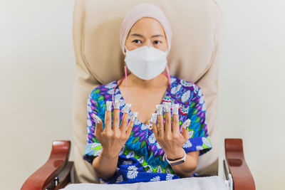 Woman getting a manicure in beauty spa salon