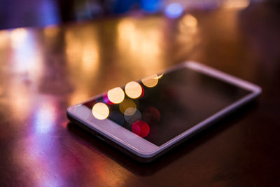 Close-up of mobile phone on table