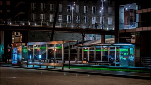 Reflection of illuminated buildings on glass at night