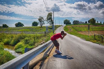 Road passing through field