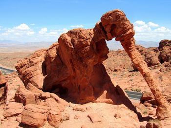 Rock formation in desert against sky