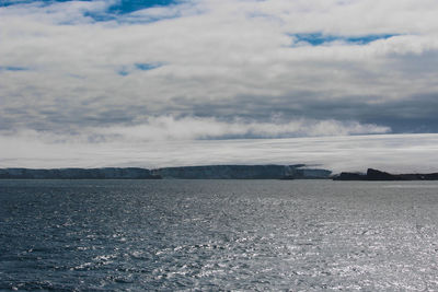 Scenic view of land against sky during winter