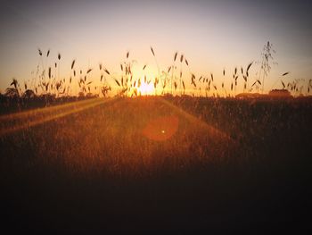 Silhouette landscape against sky during sunset