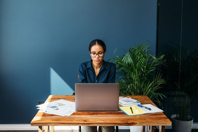 Businesswoman working at table