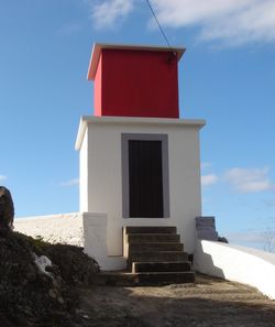 Built structure on beach against sky