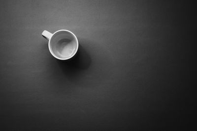 High angle view of coffee cup on table